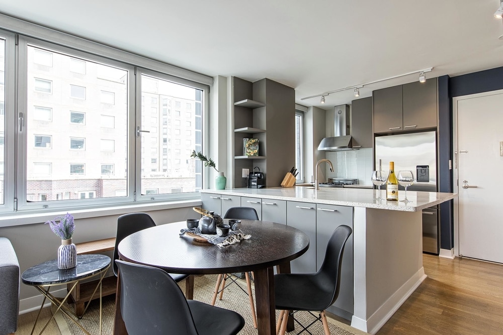  NYC east village apartment kitchen with grey furniture