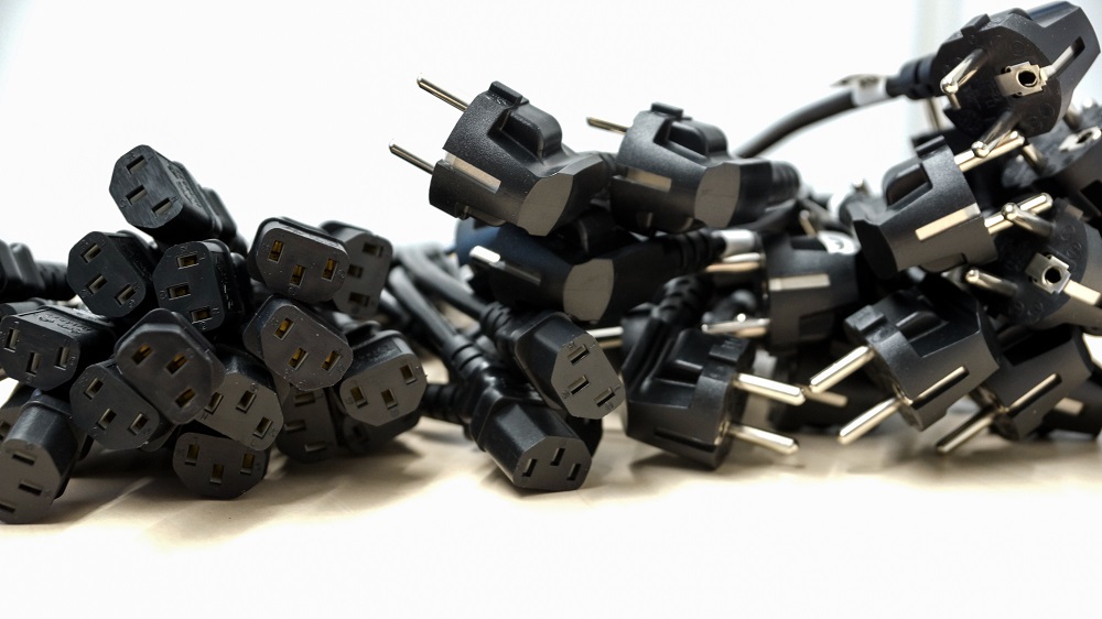 a pile of electricty plugs