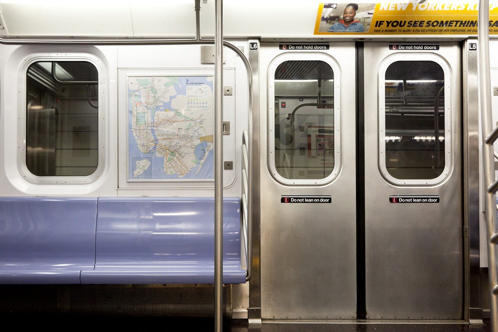 nyc subway car pulling into station
