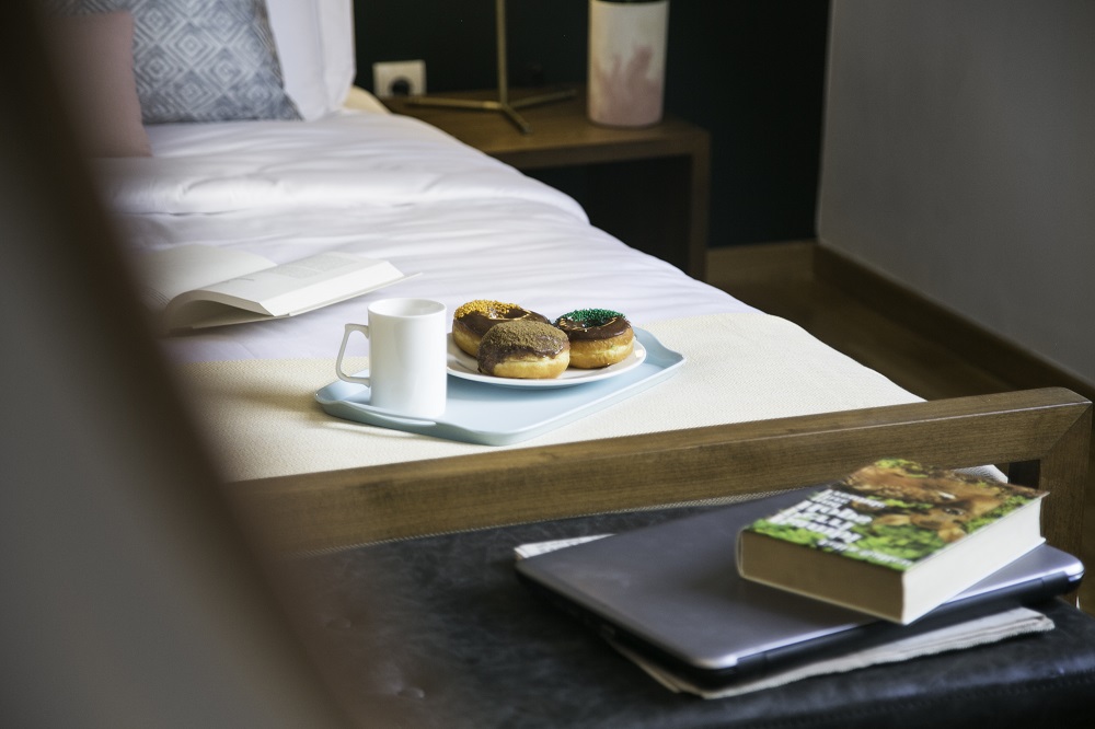 corporate traveler taste of home donuts on bed breakfast