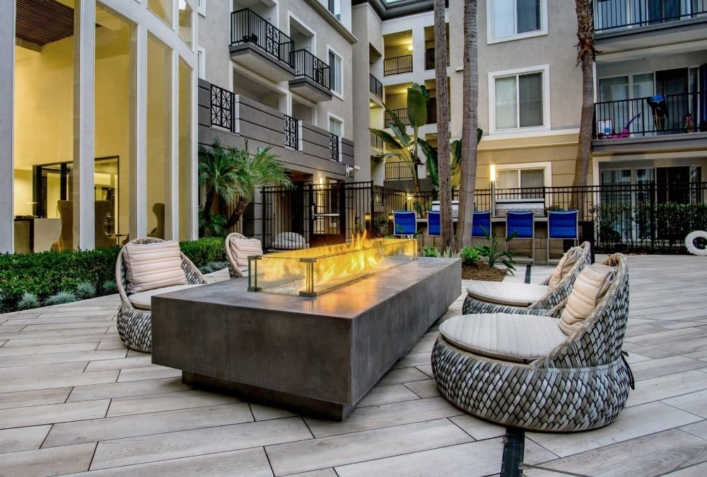 furnished apartment LA outdoor fire pit and chairs at Tierra Del Rey Apartments