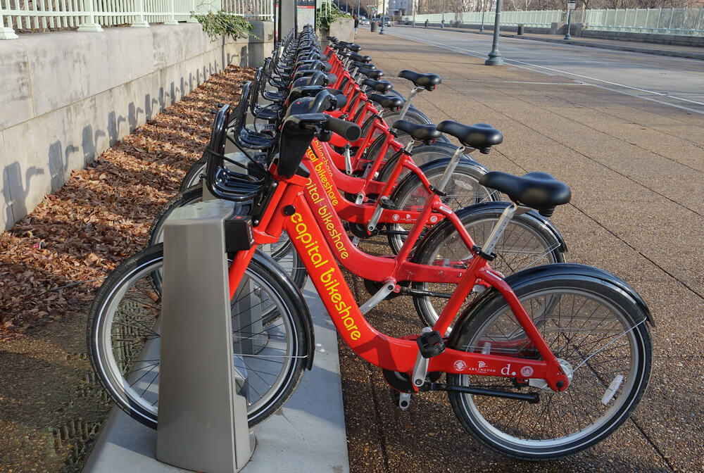 red capital bikeshare bikes lined and locked up in Washington D.C.