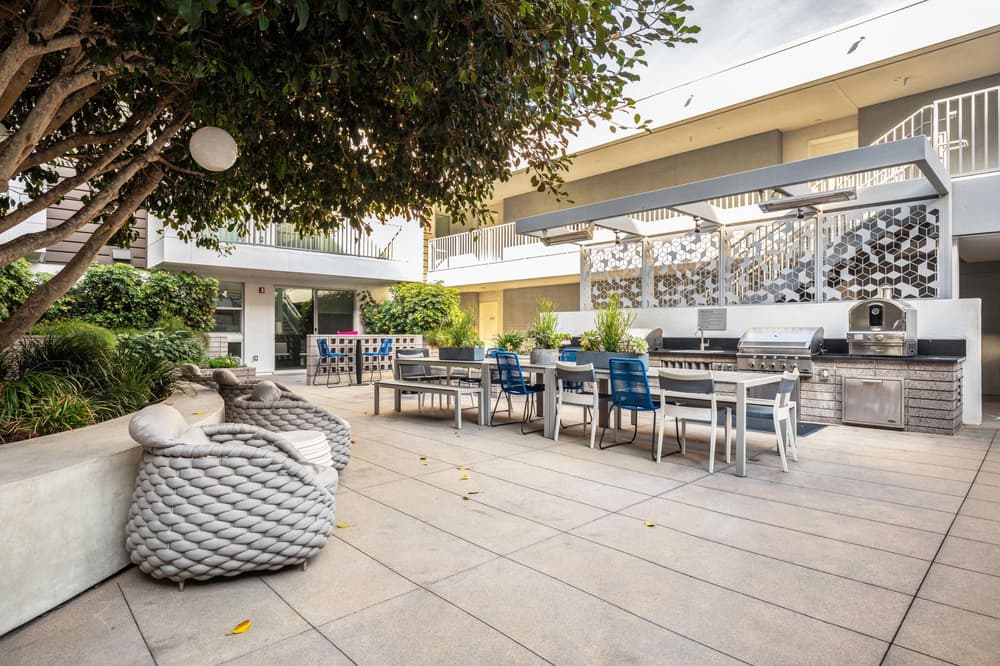 outdoor patio area with grills Domain WeHo