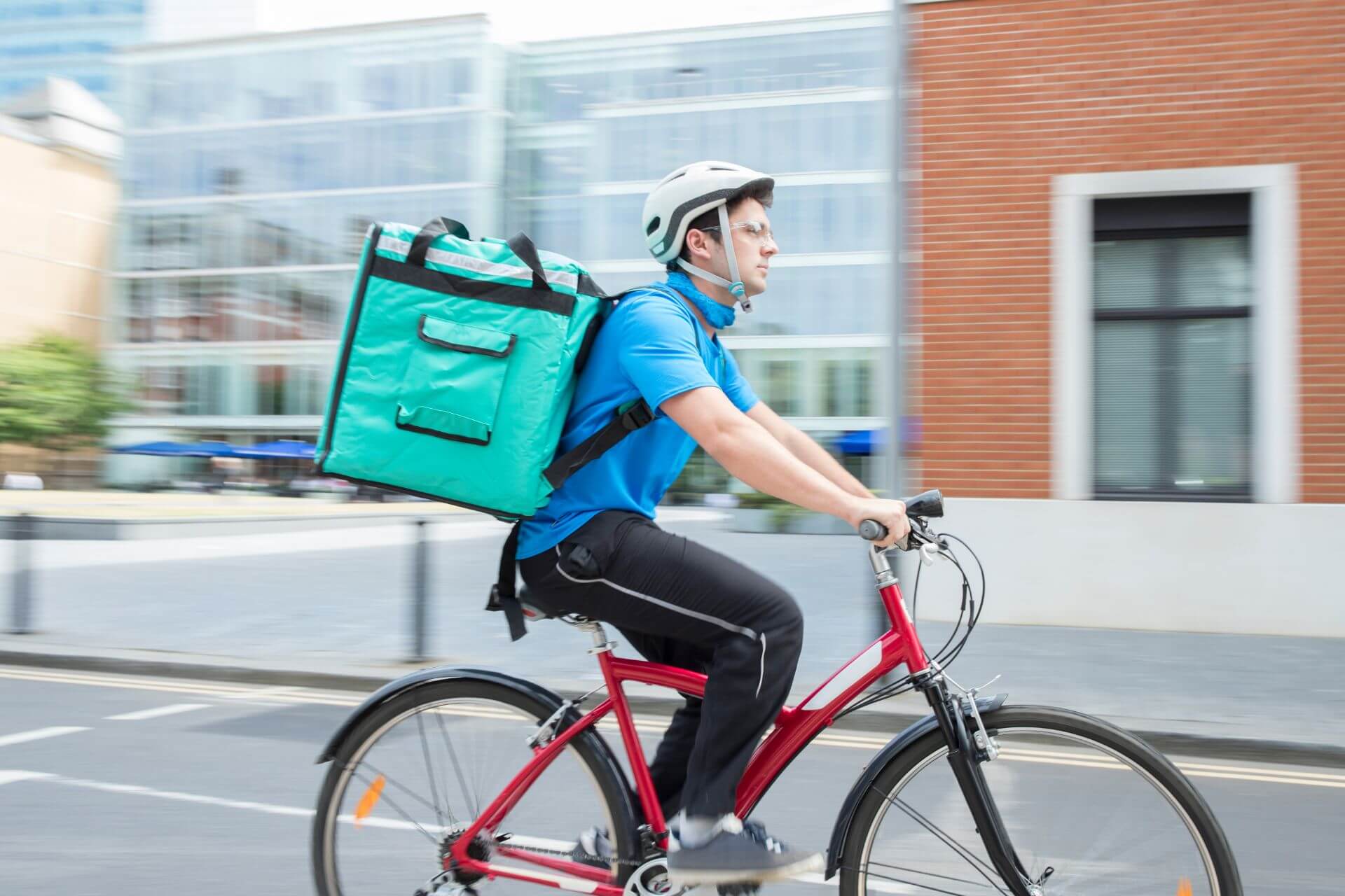 A man cycling as a food delivery driver
