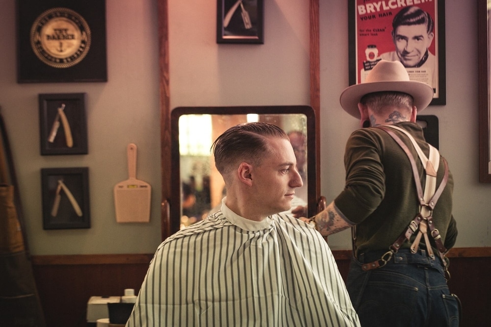 hair salon nyc a man getting a haircut at a barbers shop