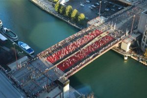 bird's-eye view of people running in a bridge at the chicago marathon