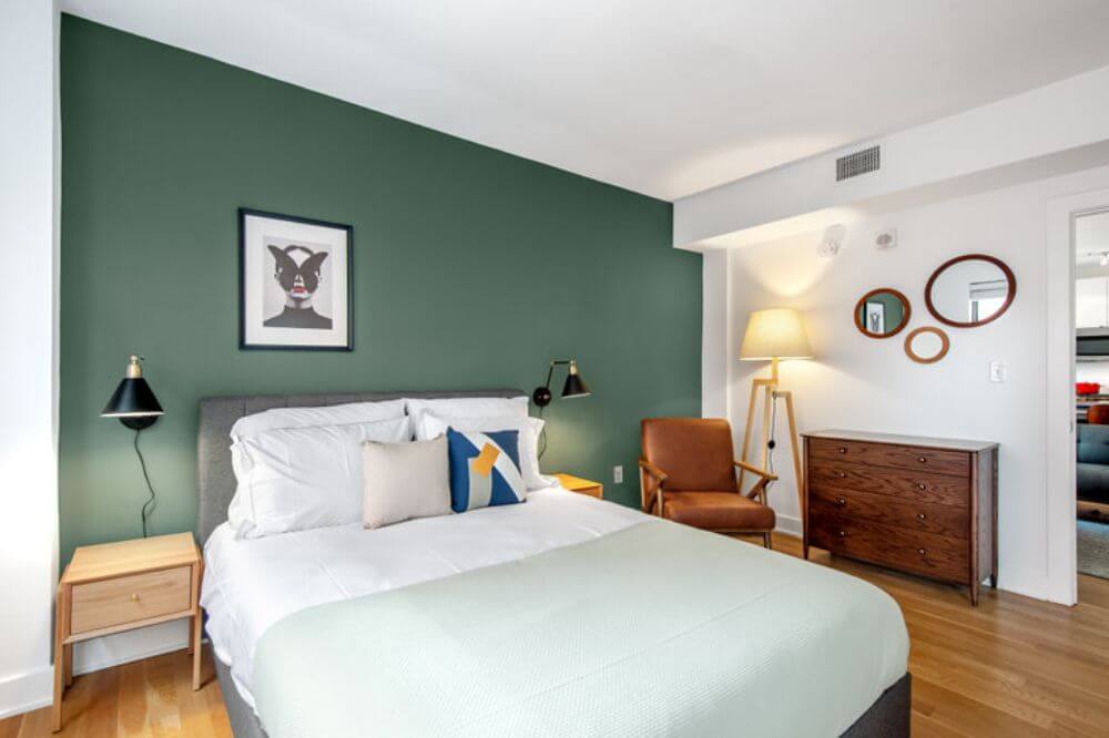 Museum memberships in D.C. a beautifully decorated blueground apartment bedroom