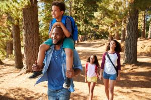family hiking in the woods