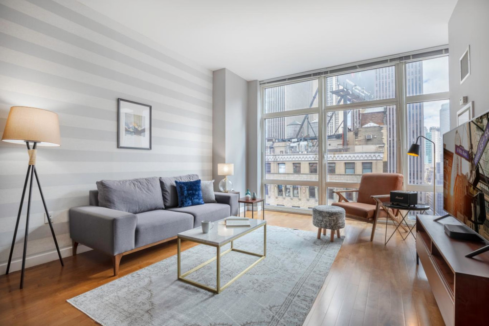 Furniture donation NYC and a living room with floor-to-ceiling windows
