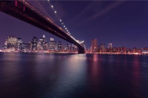 a bridge in New York City by night