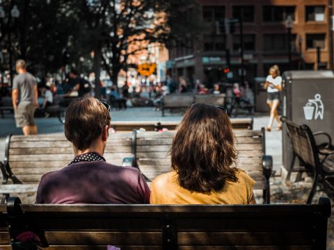 Couple sitting on a bench in Boston