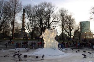 an ice sculpture in the middle of a square in Boston for the First Night Arts Celebration