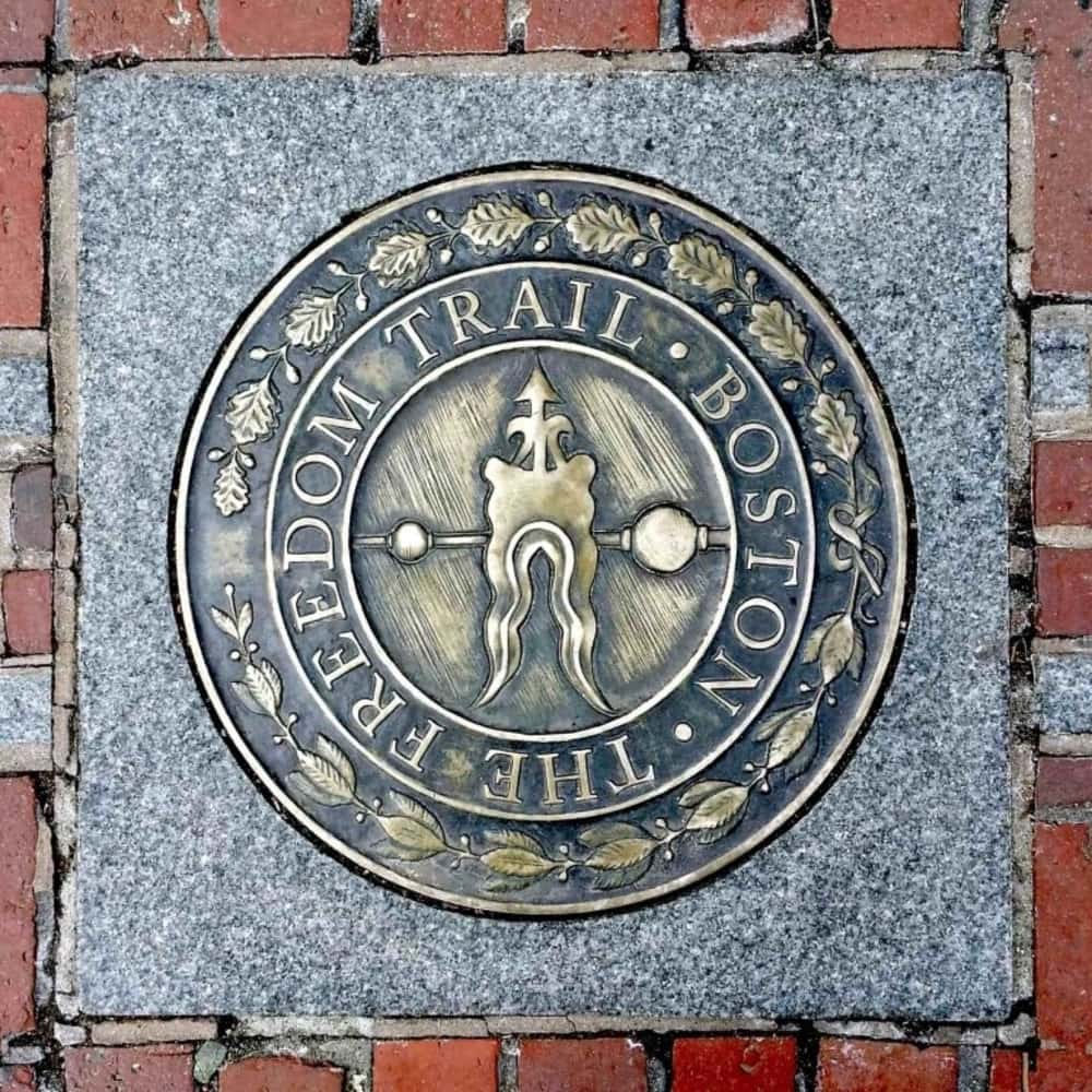 a freedom trail historic landmark in Boston made of copper and cement and surrounded by brick 