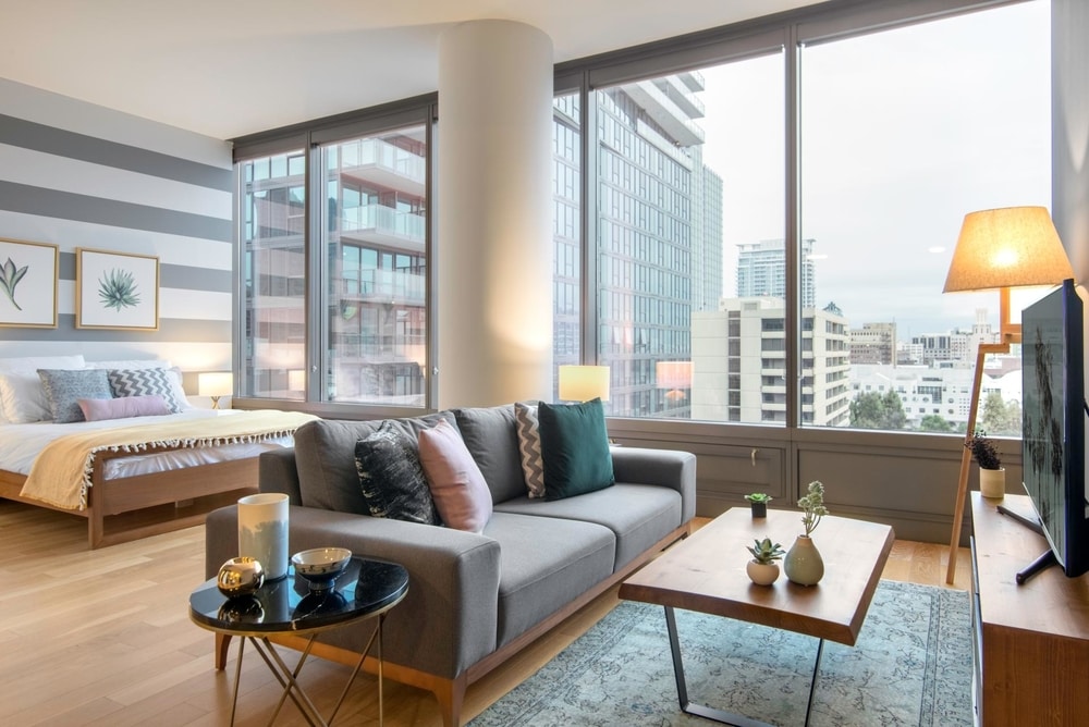 blueprint blueground studio apartment LA fully furnished studio with floor to ceiling windows beautiful view of city