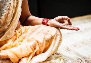 meditation centers in san francisco woman in traditional indian sari garb with left hand in a yoga mudra