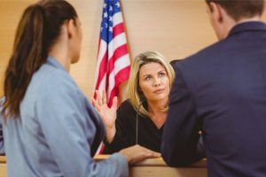 immigration lawyer people standing in court in front of a judge