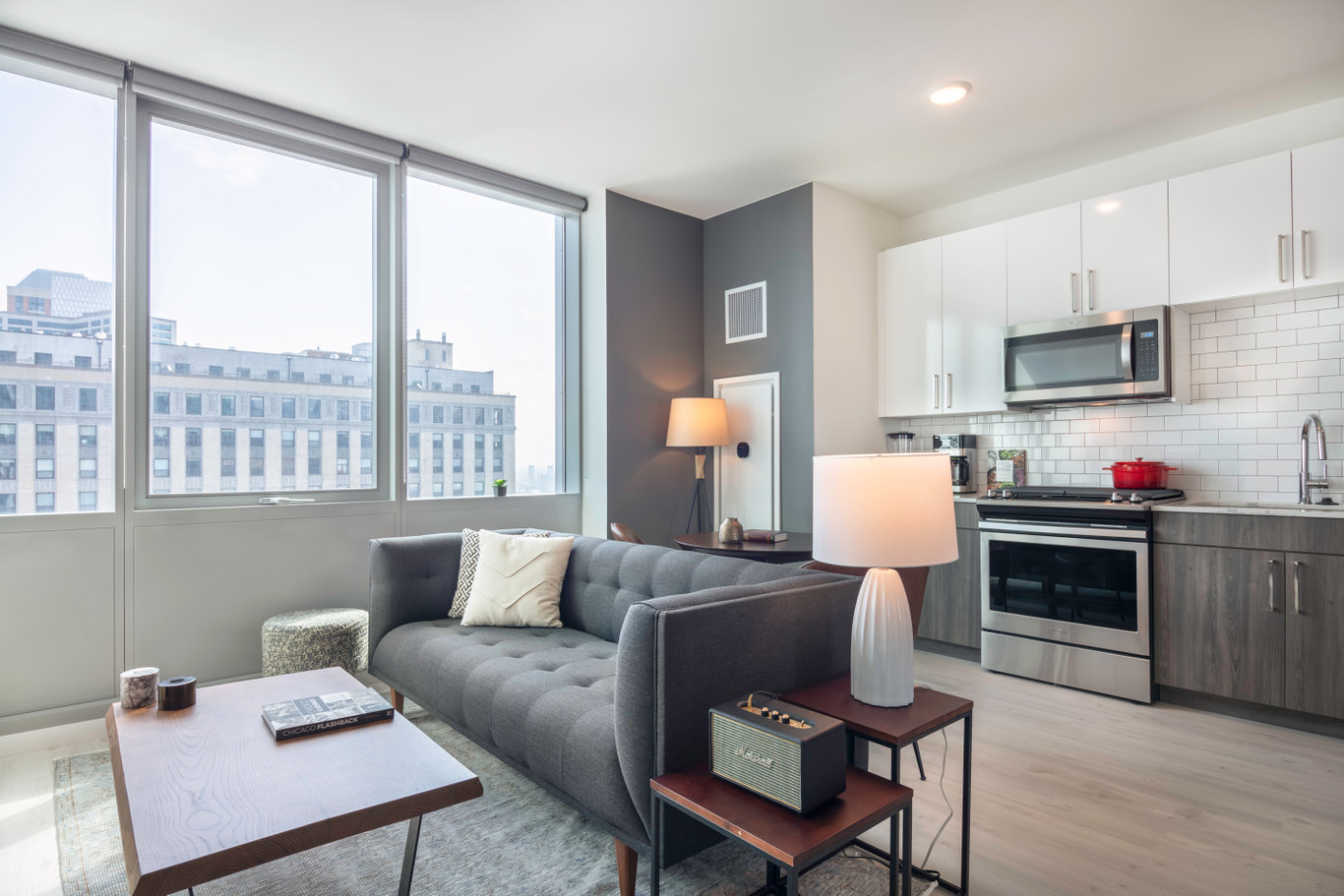 condos for rent chicago modern kitchenette with white tile backsplash