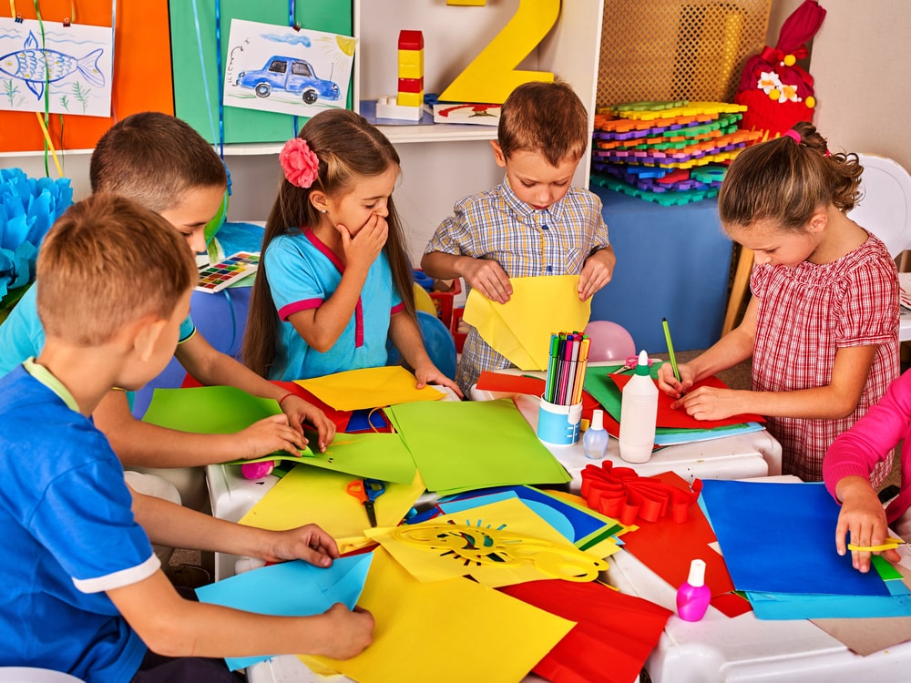 children in school doing arts and crafts projects 
