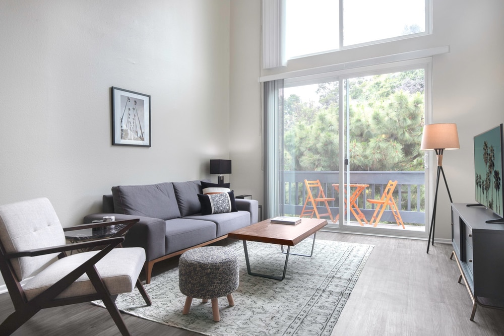 sun lit apartment with grey toned furniture
