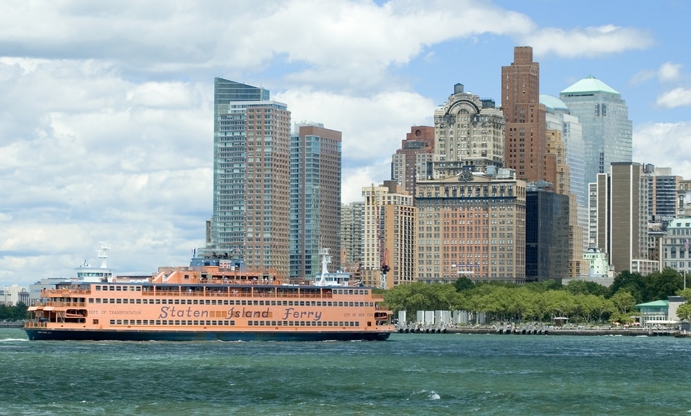 staten island ferry in upper bay of NYC against skyline of lower manhattan
