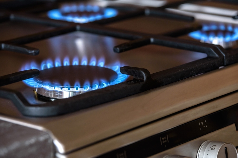 a close up to gas burners blue flame
