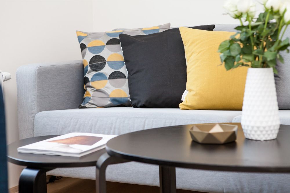 corporate housing apartment sofa and coffee table with modern touches