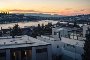 View of the sun setting over some homes in the Lake Union area