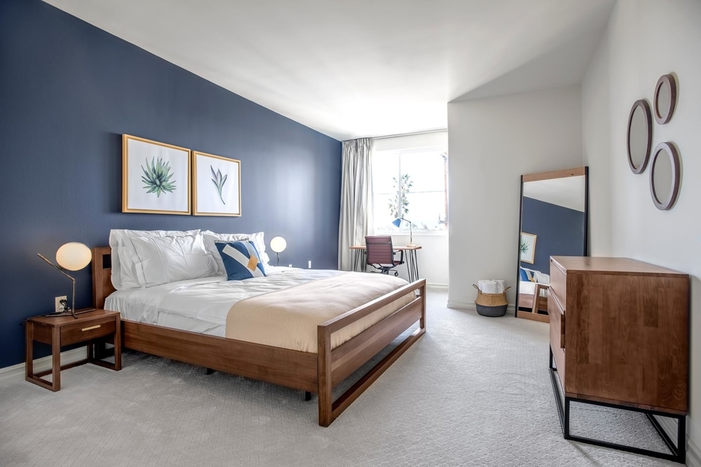 blueprint blueground short term rental los angeles bedroom dark blue grey walls with succulent print