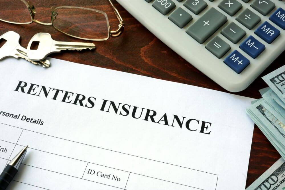 renters insurance form and other items on a desk