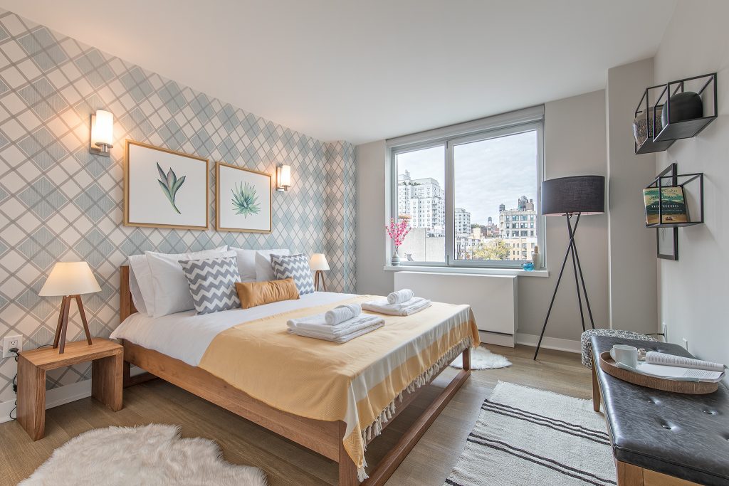 modern furnished bedroom in East Village NYC