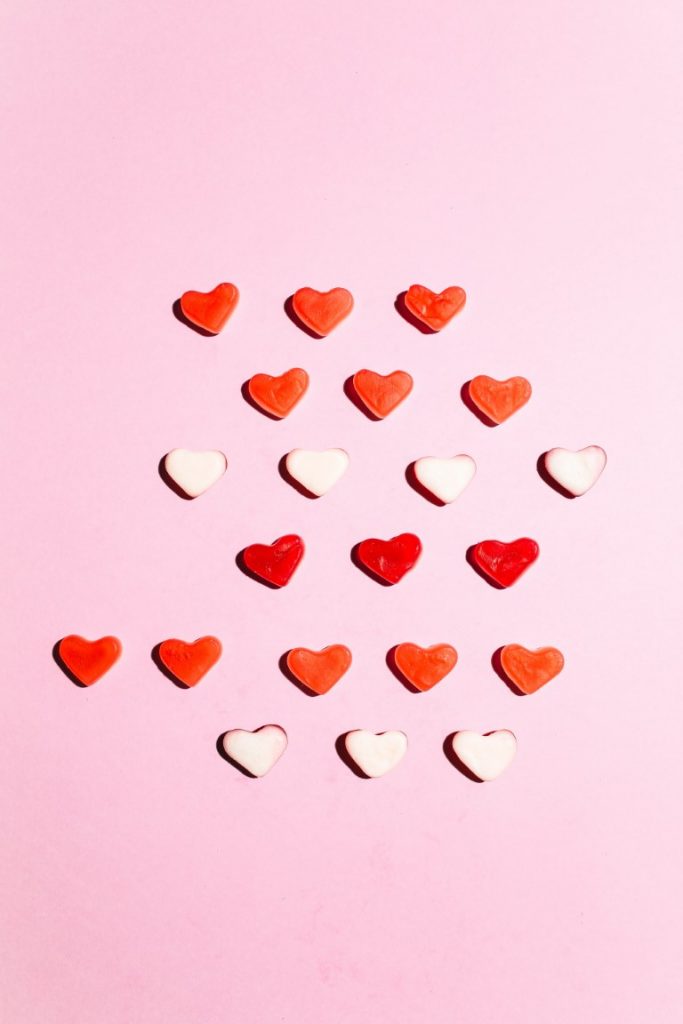 heart-shaped sweets on a pink background