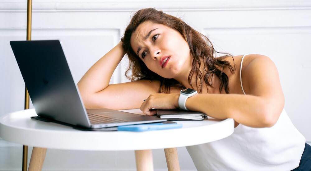 woman working on computer is tired
