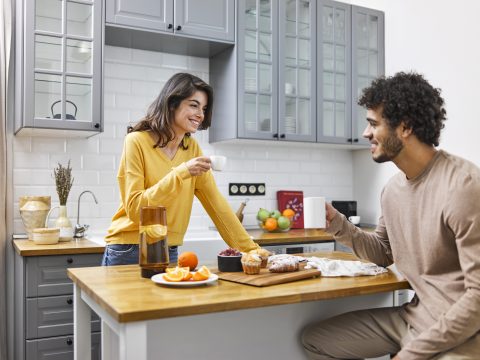 Couple eating in kitchen