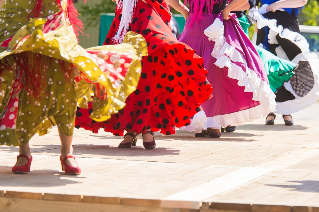 Flamenco dancers in colorful dresses
