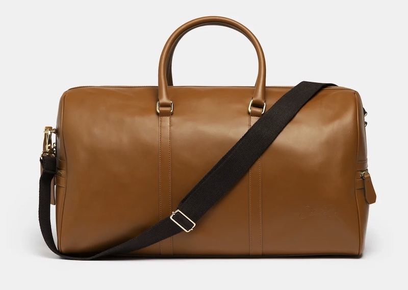 camel colored leather duffle with a shoulder strap